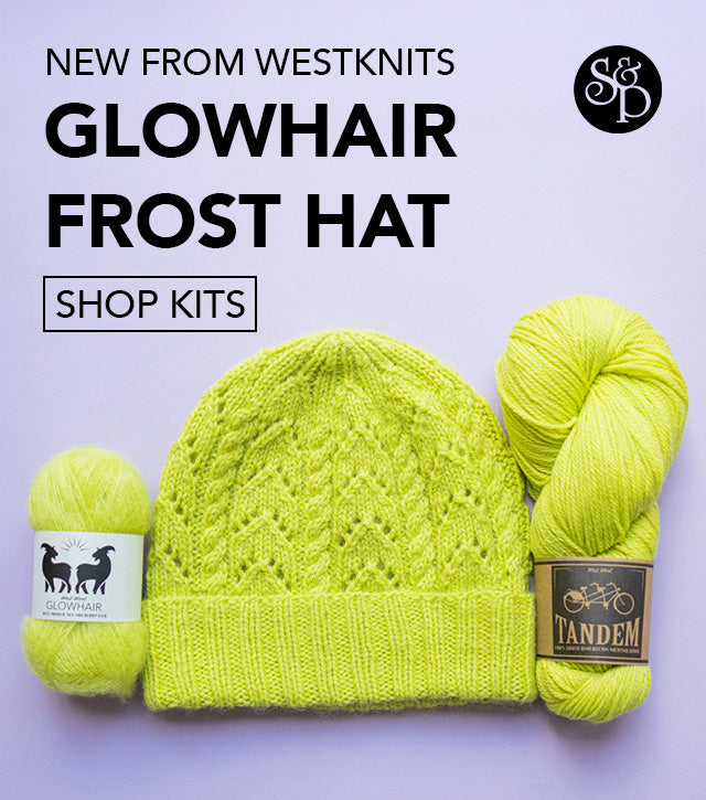 Light purple background. Picture of a hand knitted lime green lace and cable woollen beanie hat with the matching yarn that it has been made of.

Text reads New from westknits Glowhair Frost Hat Shop Kits