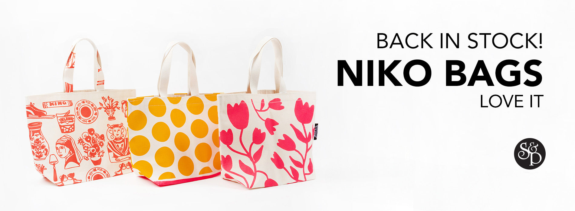 This image advertises that the Niko Bags from the brand Love It are now back in stock at Stephen& Penelope. It features the S&P black logo in the bottom right and three canvas bags on the left on a white background. The bags have  Dutch-inspired drawings in bright orange, yellow, and pink. 